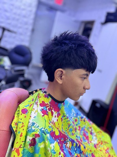 Textured cut with a fringe and tapered sides.