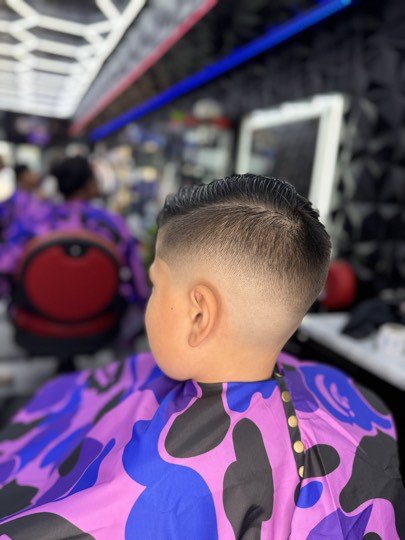 High fade with a flat top and a straight line up, back view.