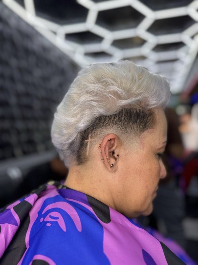Short cut dyed platinum with a skin fade on the side.