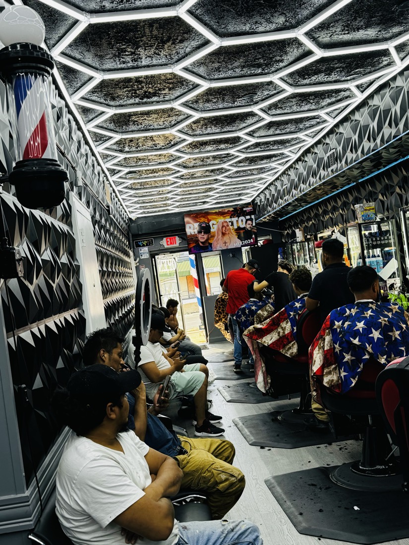 Customers waiting for their turn at Morales Barbershop MB on a Saturday.