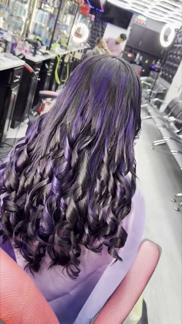 Video: long wavy hair dyed lavender.