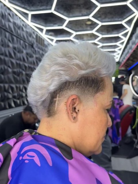 Video: short cut dyed platinum with a skin fade on the side.